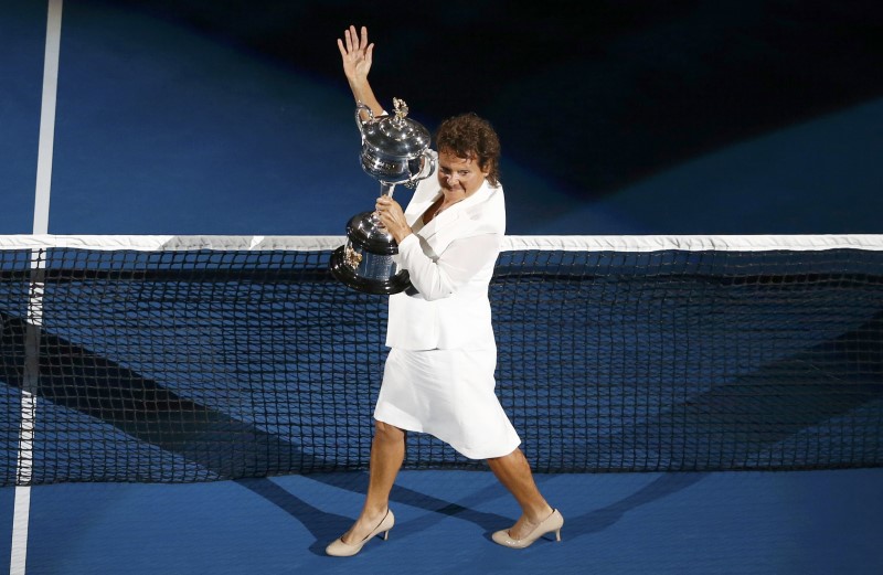 FILE PHOTO: Former tennis player Goolagong-Cawley arrives with the women's singles trophy before the final match between Williams of the U.S. and Germany's Kerber at the Australian Open tennis tournament at Melbourne Park