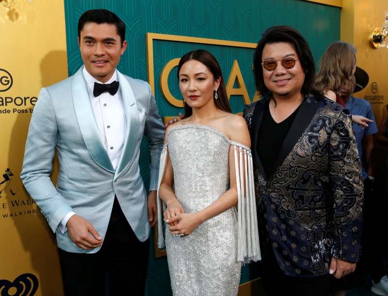 Author Kwan and cast members Golding and Wu pose at the premiere for