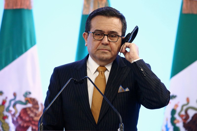 FILE PHOTO: Mexican Economy Minister Guajardo holds his headset during a joint news conference on the closing of the seventh round of NAFTA talks in Mexico City