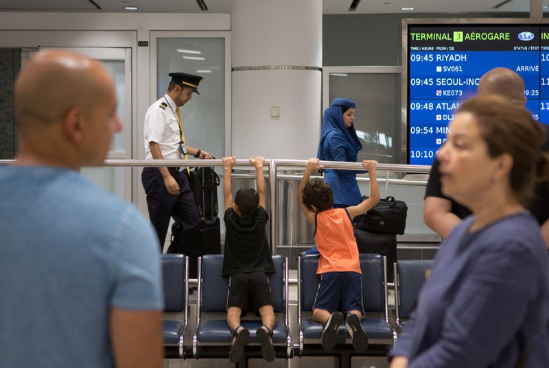 People arrive at Toronto Pearson International Airport from Saudi Airlines flight from Riyadh in Toronto