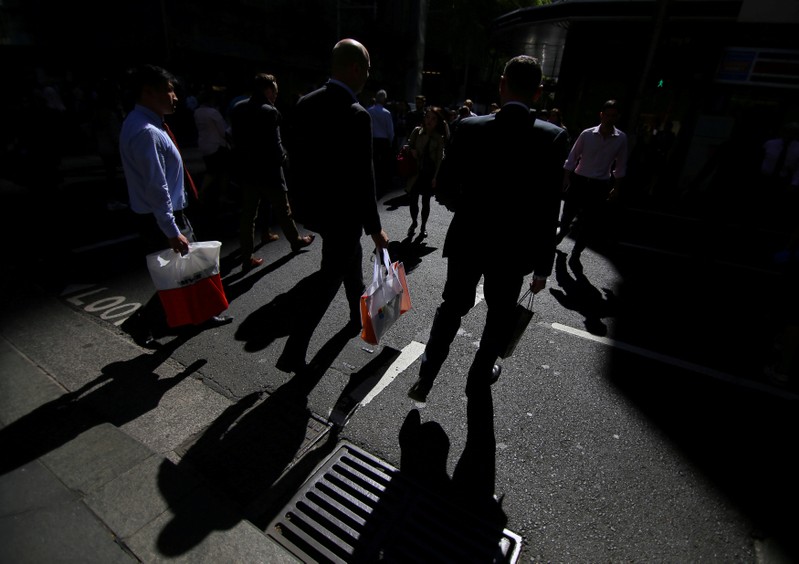 FILE PHOTO: Workers walk on the streets of Sydney, Australia