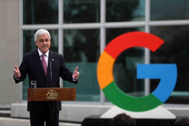 Chile's President Sebastian Pinera delivers a speech near a Google logo during the announcement of the plans for their data centre expansion in Santiago