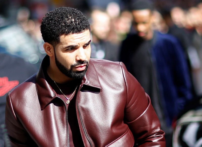 Drake arrives on the red carpet for the film