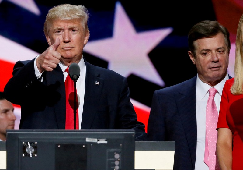 FILE PHOTO: Republican presidential nominee Donald Trump gives a thumbs up as his campaign chairman Paul Manafort looks on during Trump's walk through at the Republican National Convention in Cleveland