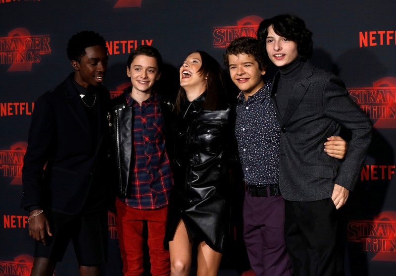 FILE PHOTO: Cast members McLaughlin, Schnapp, Brown, Matarazzo and Wolfhard pose at the premiere for the second season of the television series