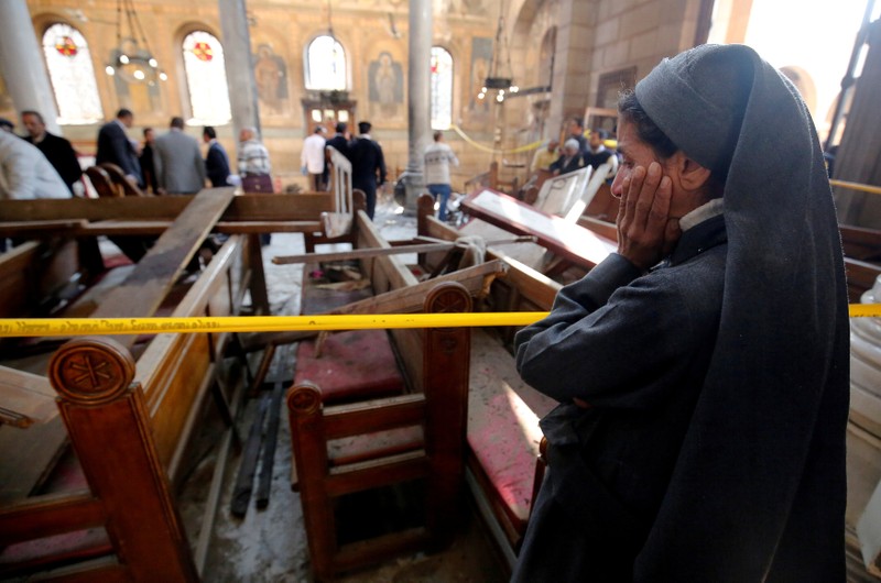 FILE PHOTO: A nun cries at the scene of the bombing inside Cairo's Coptic cathedra