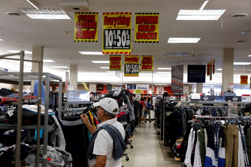 FILE PHOTO: Store closing signs advertising discounts at a Sears in New Hyde Park, New York