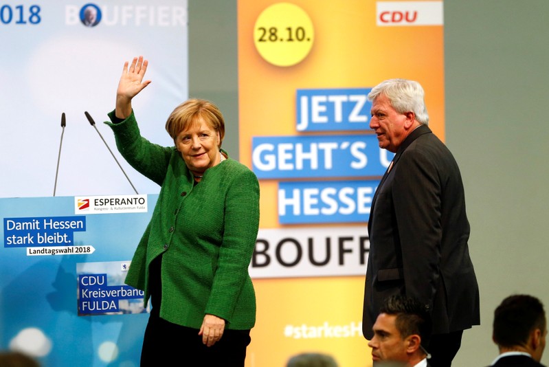 Prime Minister Volker Bouffier and German Chancellor Angela Merkel attend the final campaign rally prior to the upcoming state election in Fulda