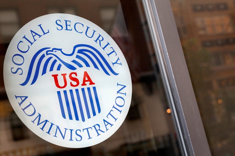 FILE PHOTO: FILE PHOTO Sign is seen on the entrance to a Social Security office in New York