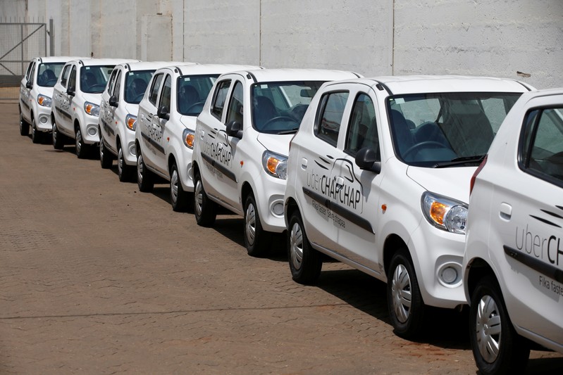 Suzuki cars branded with Uber stickers are seen in a showroom in Nairobi