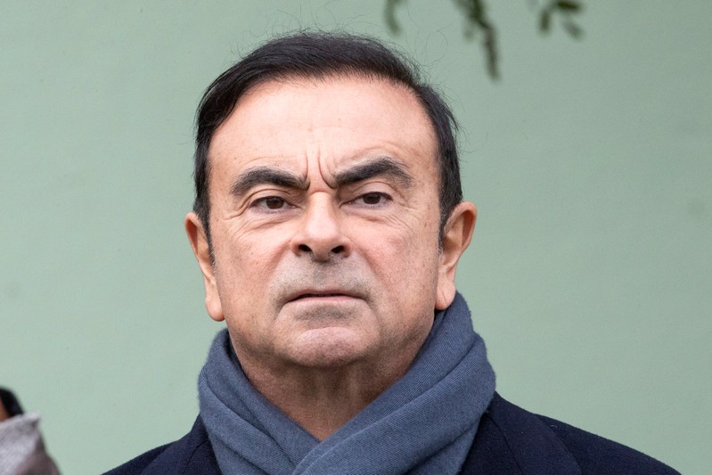Renault CEO Carlos Ghosn waits for French President Emmanuel Macron for a visit of the Renault factory in Maubeuge