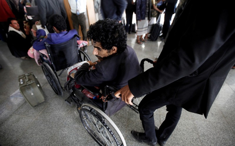 Wounded Houthi fighters wait at Sanaa airport during his evacuation from Yemen