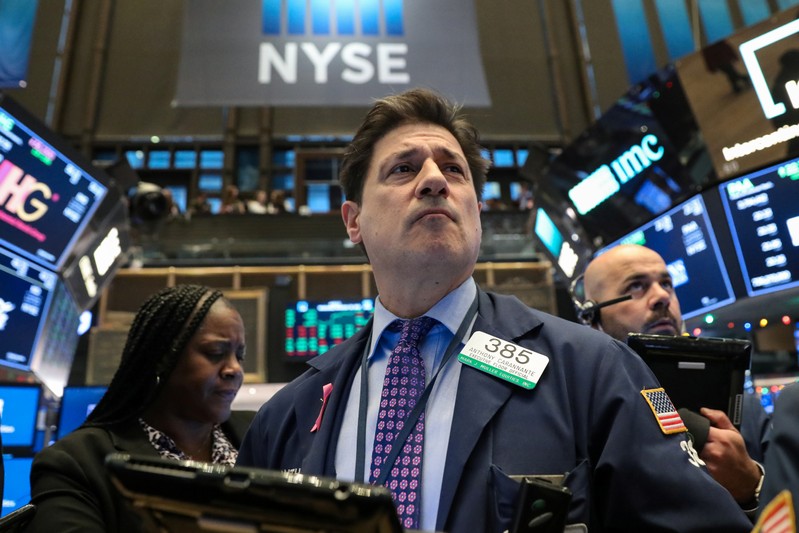 Traders work on the floor of the NYSE in New York