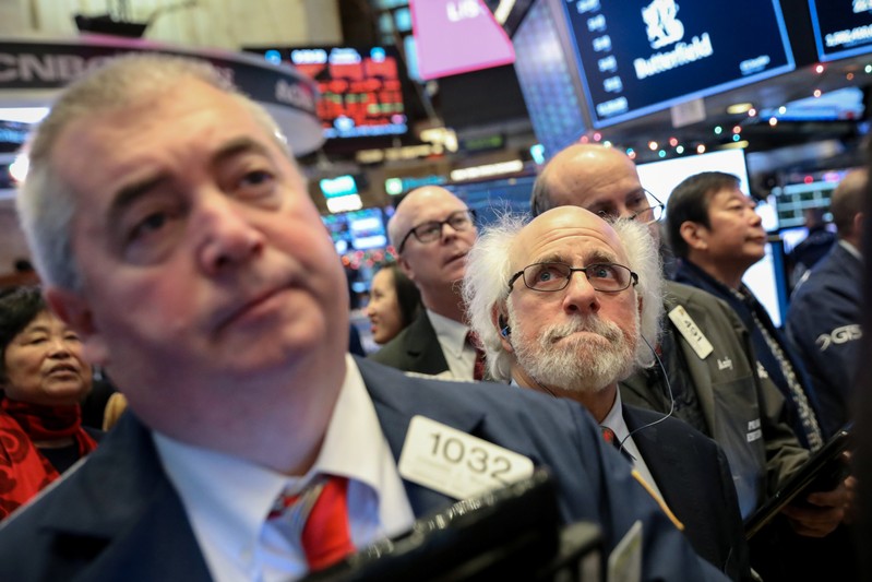 Traders work on the floor of the NYSE in New York