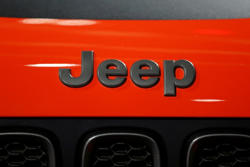 Car manufacturers display their wares on the show floor of the North American International Auto Show in Detroit