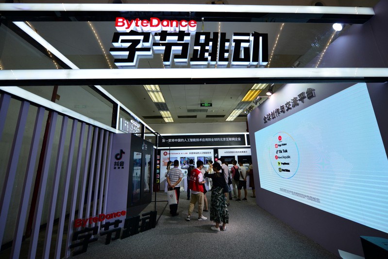 FILE PHOTO - Visitors are seen at the booth of Bytedance Technology at the China International Software Expo in Beijing