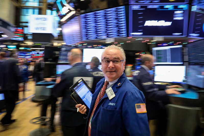 Traders work on the floor of the NYSE in New York