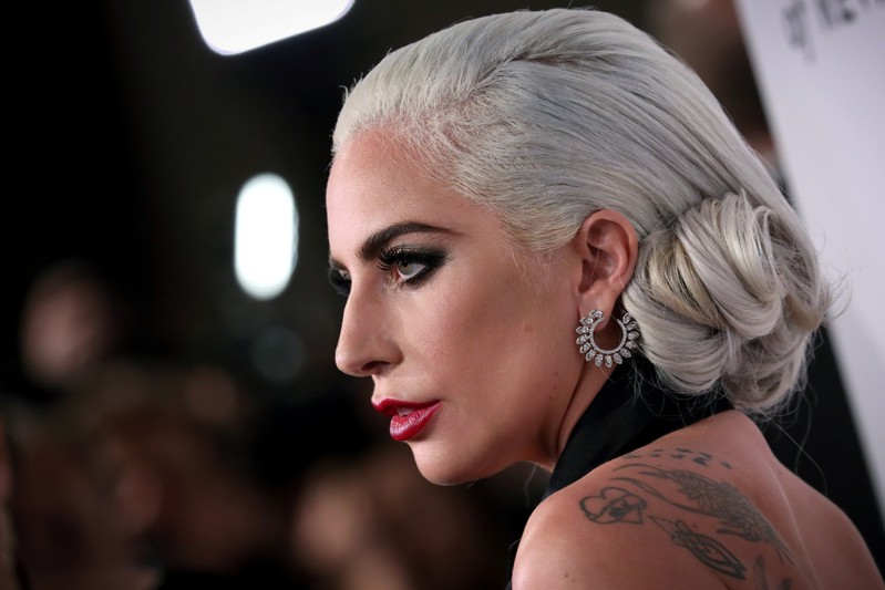 Lady Gaga poses for photographers as she arrives for the National Board of Review Awards gala in New York