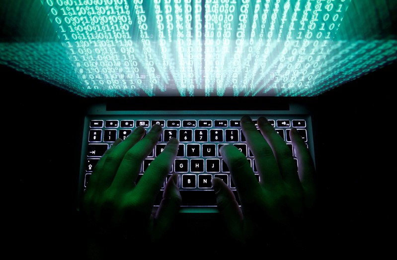 FILE PHOTO: Man types on computer keyboard in this illustration picture