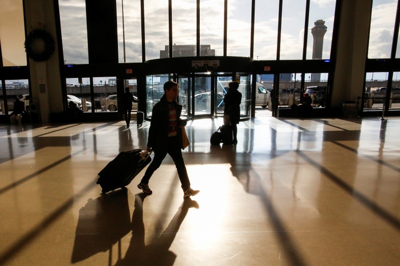 Travelers make their way through Newark Liberty International Airport in Newark, New Jersey