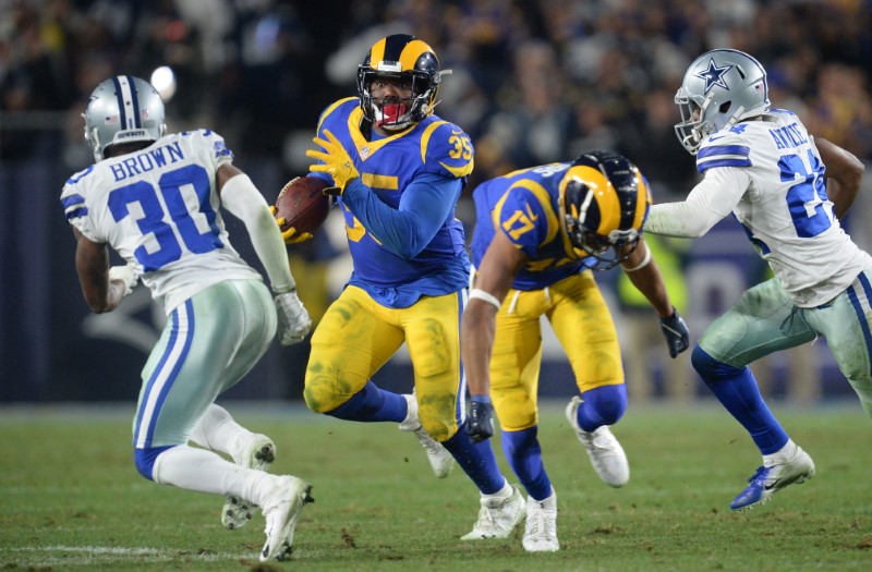 Elliott rushes for playoff career low in loss to Rams Elliott rushes for playoff career low in loss to Rams