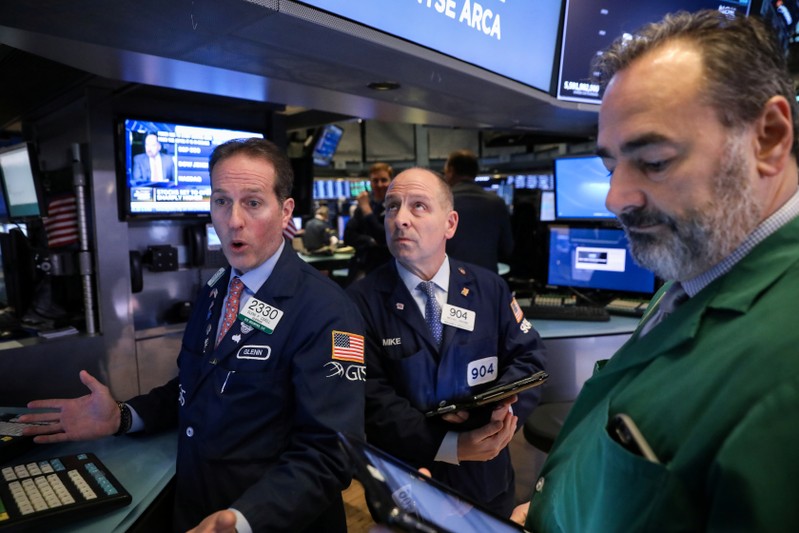 Traders work on the floor of the NYSE in New York