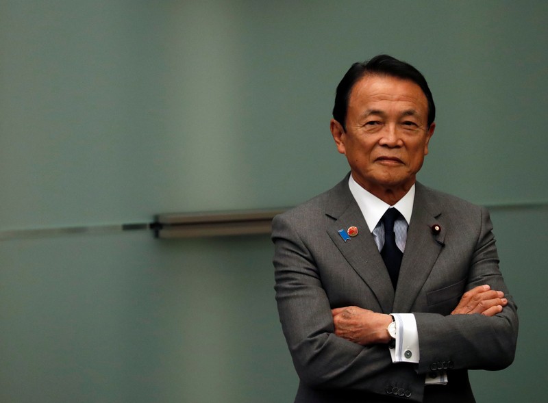 Japanese Deputy Prime Minister and Finance Minister Taro Aso looks on during Prime Minister Shinzo Abe and U.S. Vice President Mike Pence's joint news announcement in Tokyo, Japan