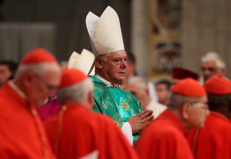 Gerhard Ludwig Muller of Germany arrives during a consistory ceremony led by Pope Francis in Saint Peter's Basilica at the Vatican