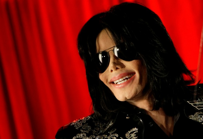 U.S. pop star Michael Jackson gestures during a news conference at the O2 Arena in London