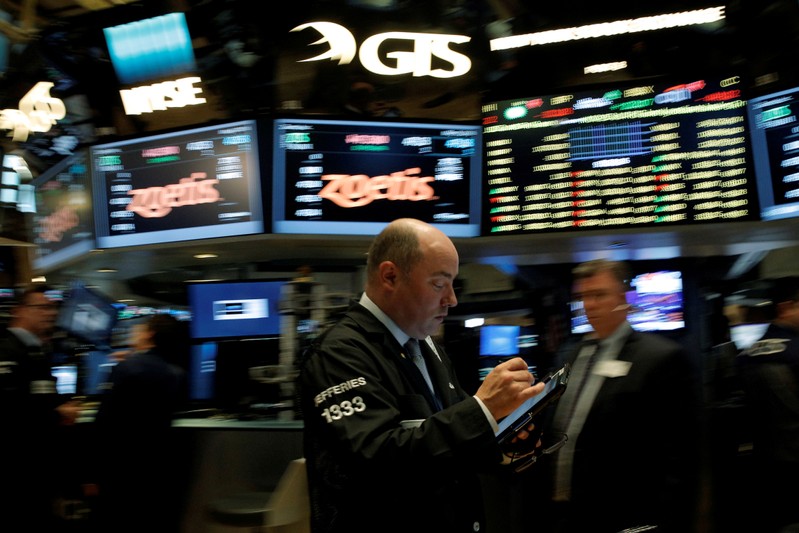 Traders work on the floor of the NYSE