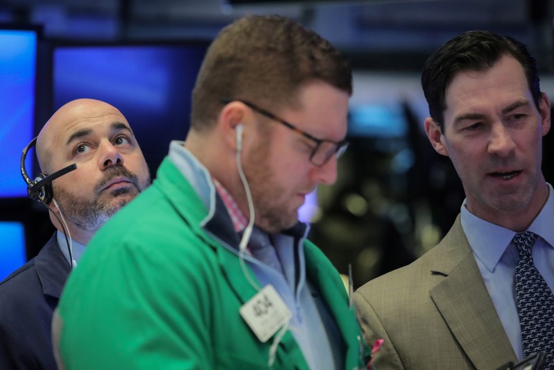 Traders work on the floor of the NYSE in New York