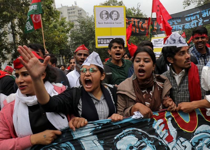 Demonstrators shout slogans as they participate in a march demanding jobs and better education facilities, in New Delhi