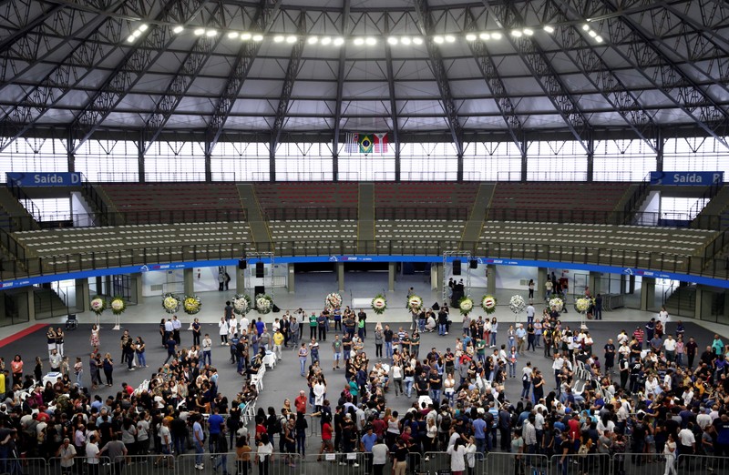 People attend a funeral of the victims killed in a shooting at Raul Brasil school, in Suzano