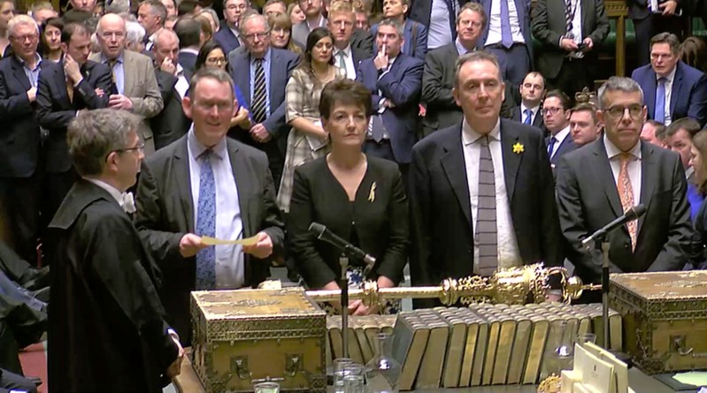 Tellers announce the results of the vote on extending Brexit negotiating period in Parliament in London