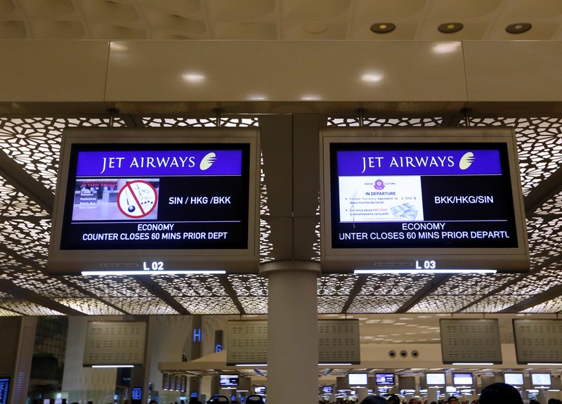 FILE PHOTO: Jet Airways flight information is seen at check-in counters inside the international airport in Mumbai