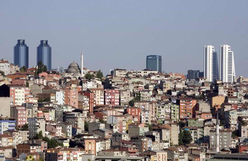 FILE PHOTO: Skyscrapers in the city's business district shape the skyline over Gultepe district in Istanbul