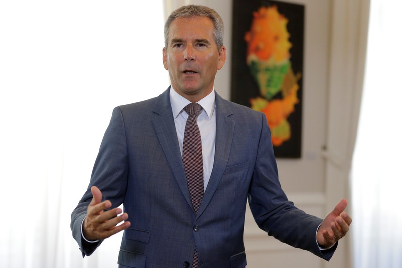 Austria's Finance Minister Loeger addresses the media before a cabinet meeting in Vienna
