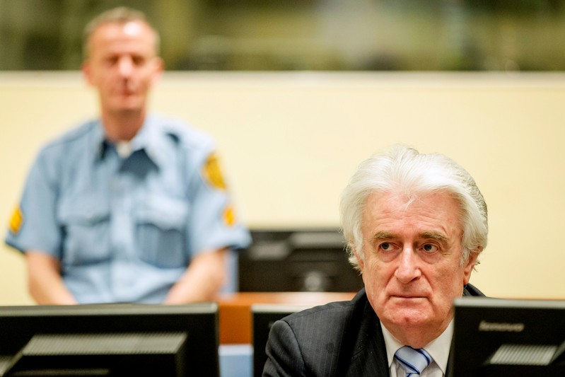 FILE PHOTO: Ex-Bosnian Serb leader Karadzic sits in the court of the International Criminal Tribunal for former Yugoslavia in The Hague