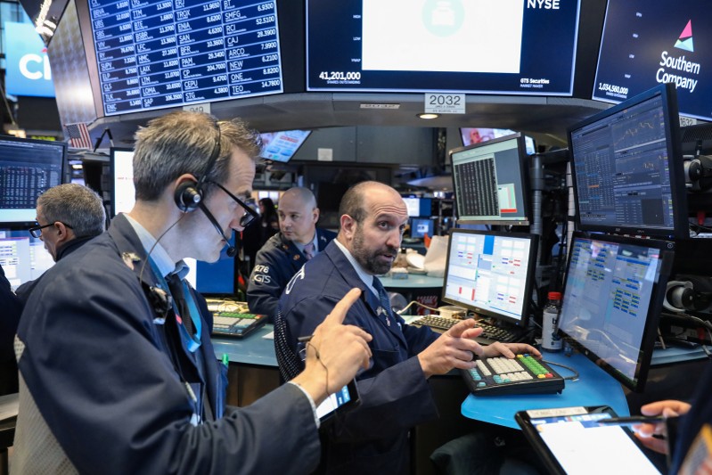 Traders work on the floor of the NYSE in New York
