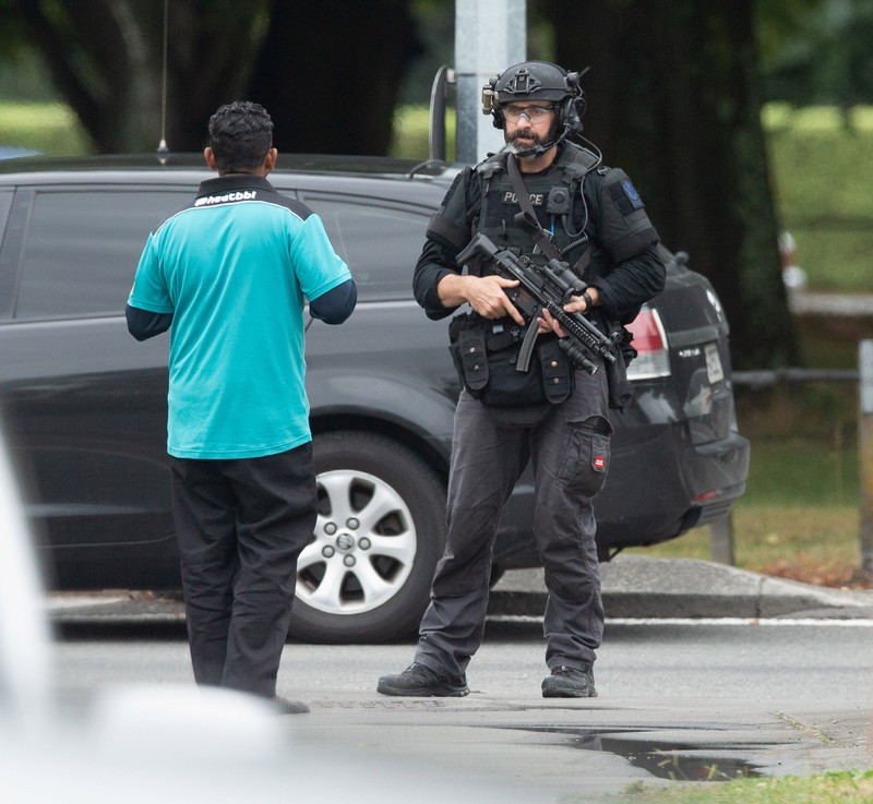 AOS (Armed Offenders Squad) push back members of the public following a shooting at the Al Noor mosque in Christchurch