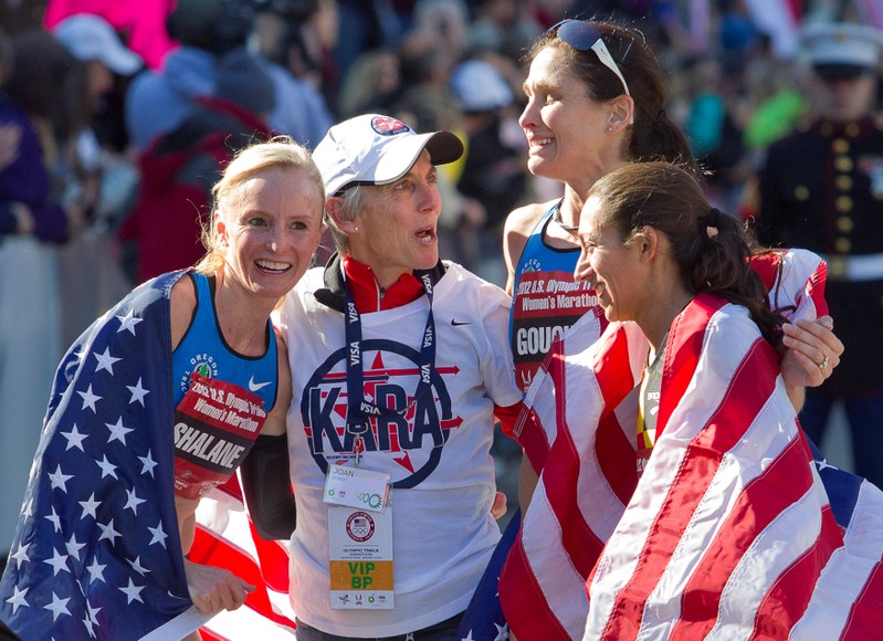 FILE PHOTO: Benoit Samuelson congratulates the top three women finishersat the finish line of the U.S. Olympic Trials Marathon in Houston
