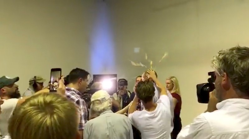 Australian Senator Fraser Anning has an egg smashed on his head while talking to the media in Victoria