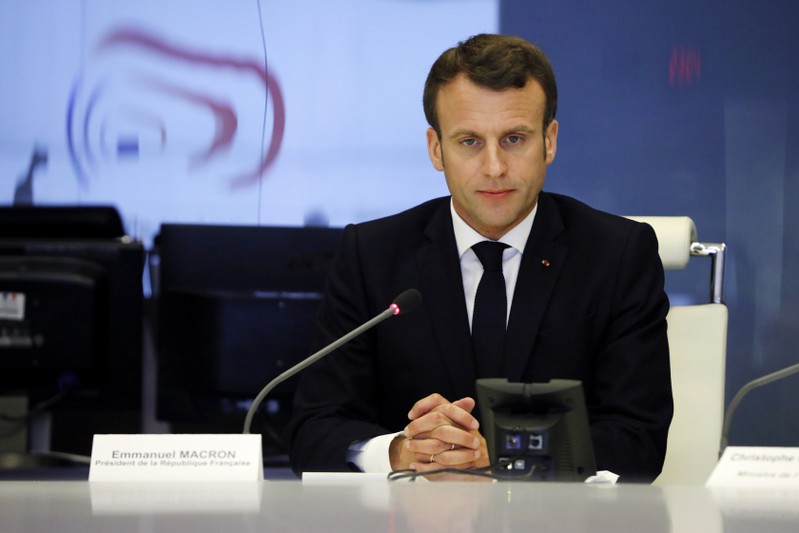 French President Emmanuel Macron presides over an emergency crisis meeting at the Interior Ministry in Paris