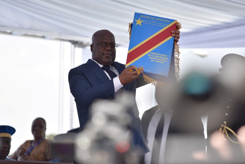 FILE PHOTO: Felix Tshisekedi holds up the constitution during his presidential the inauguration ceremony in Kinshasa, Democratic Republic of Congo