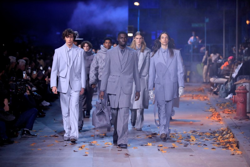 Models present creations by designer Virgil Abloh as part of his Fall/Winter 2019-2020 collection show for fashion house Louis Vuitton during Men's Fashion Week in Paris
