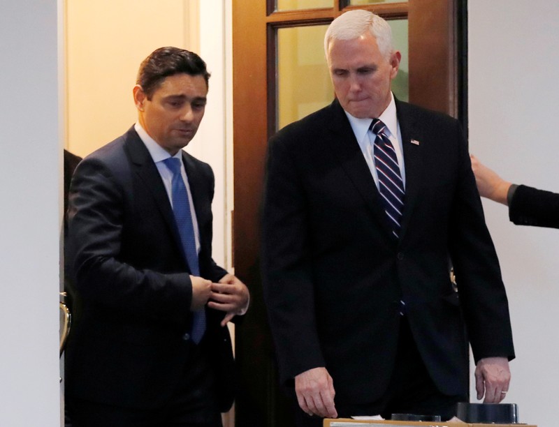 FILE PHOTO: U.S. Vice President Mike Pence and Carlos Alfredo Vecchio leave the White House after their meeting in Washington