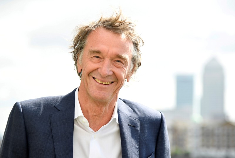 FILE PHOTO: Ratcliffe, CEO of British petrochemicals company INEOS, poses for a portrait with the Canary Wharf financial district seen behind, ahead of a news conference announcing the launch of a British America's Cup sailing team in London, Britain