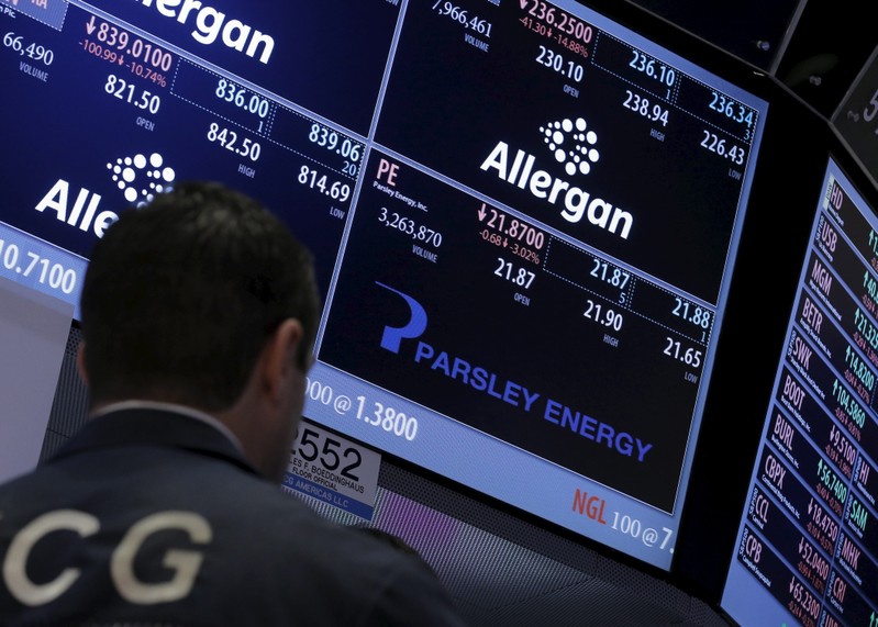 A trader works at the post that trades Parsley Energy Inc. and Allergan Plc., on the floor of the NYSE