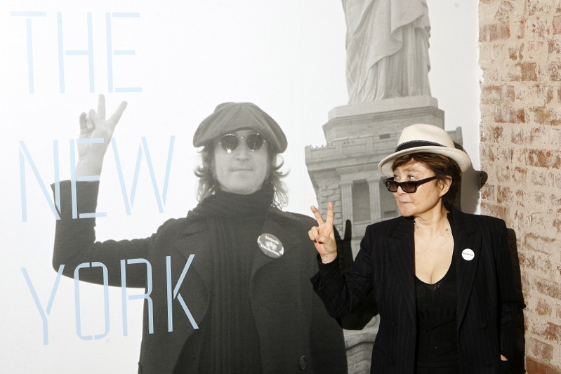 FILE PHOTO: Yoko Ono gestures as she unveils the