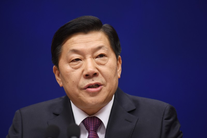 Lu Wei, head of Cyberspace Administration of China, attends a news conference in Beijing
